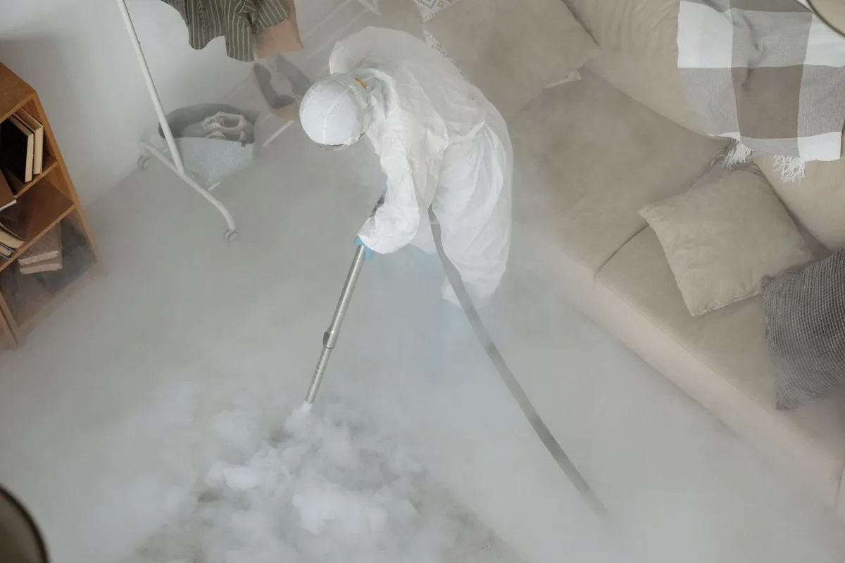 Biohazard cleanup technician in protective equipment, Ripley, TN